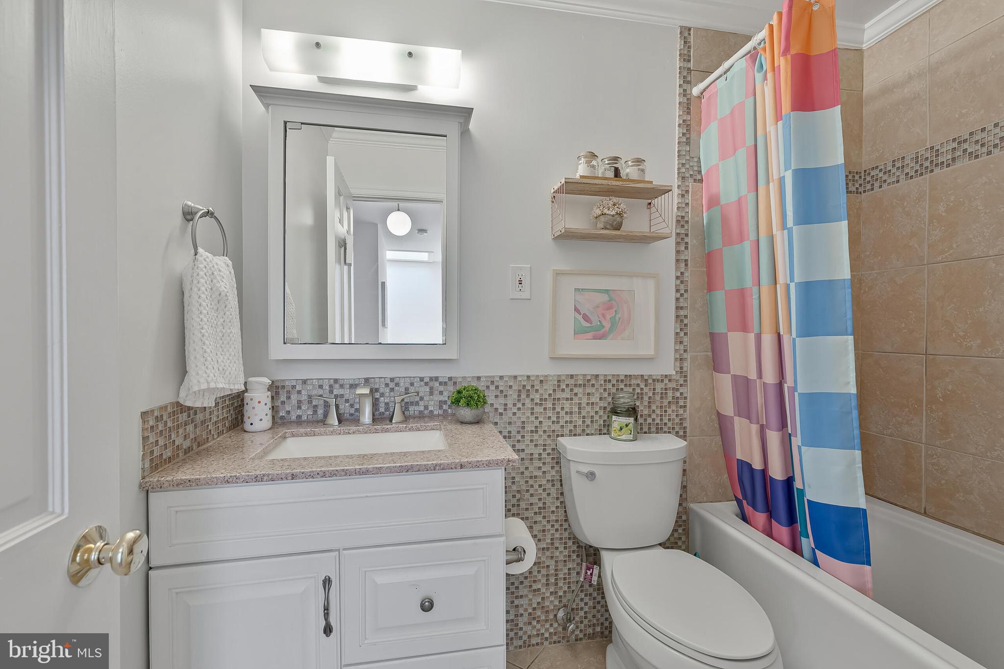 1340 North Lynnbrook Drive Arlington, VA 22201 - Photo 33 of 57 a bathroom with a toilet sink and mirror
