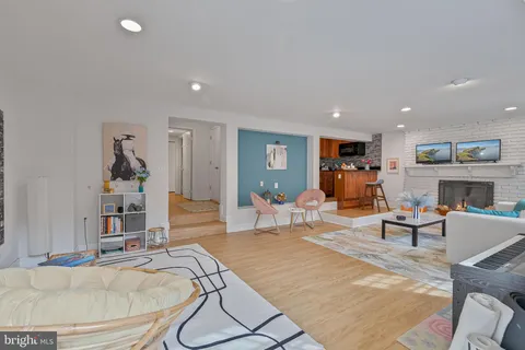 a kitchen with stainless steel appliances granite countertop a refrigerator sink stove and microwave