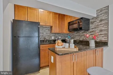 a bathroom with a shower curtain and a sink