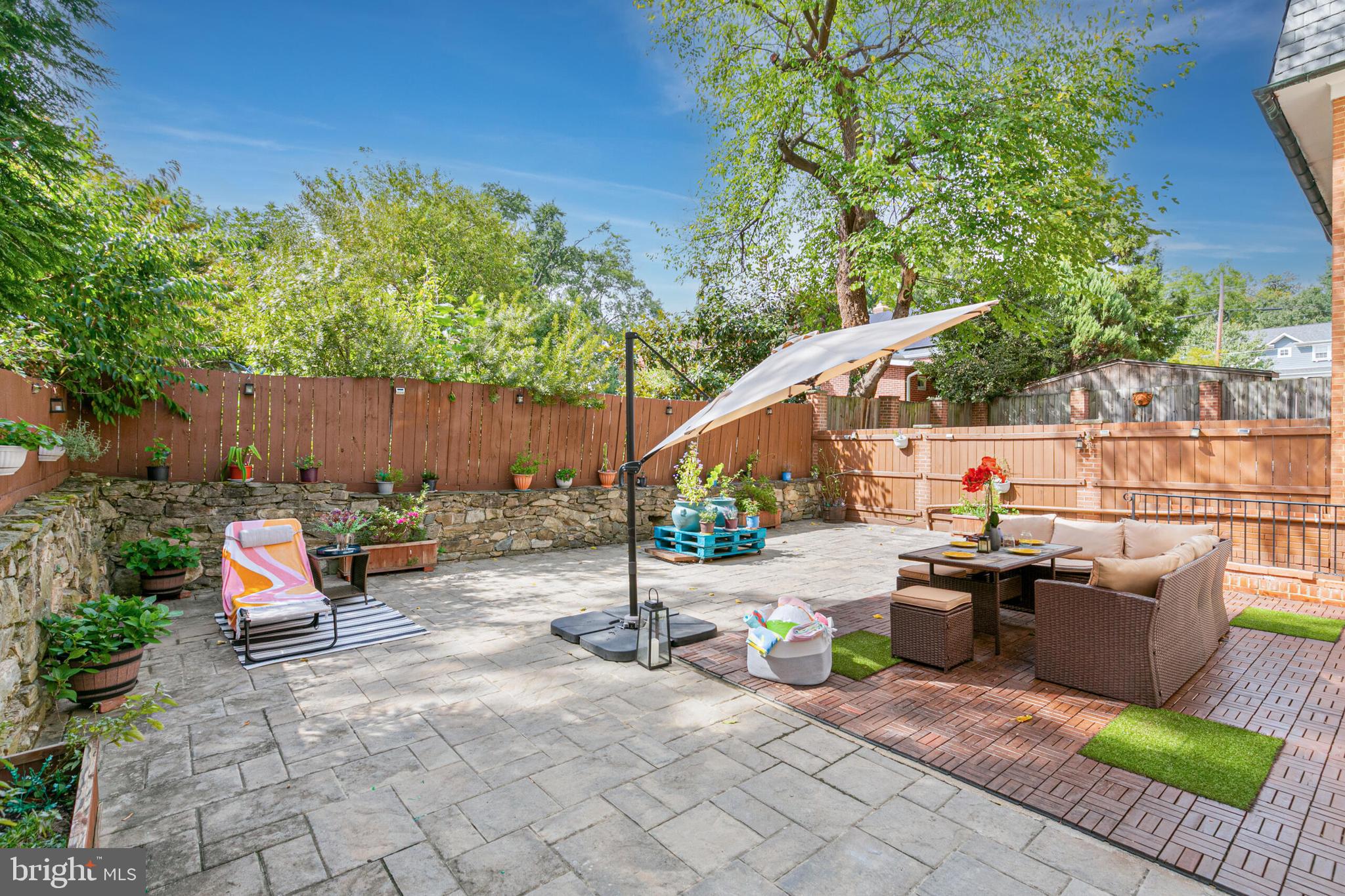 1340 North Lynnbrook Drive Arlington, VA 22201 - Photo 48 of 57 an outdoor space with patio furniture and potted plants