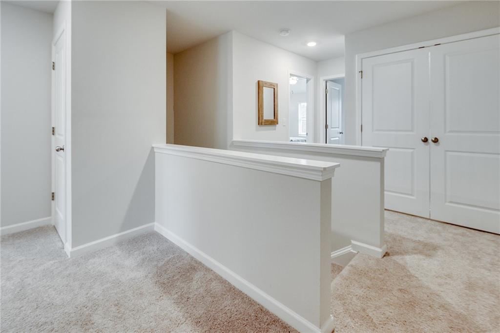 7437 Knoll Hollow Road Lithonia, GA 30058 - Photo 25 of 46 a view of a hallway to rooms