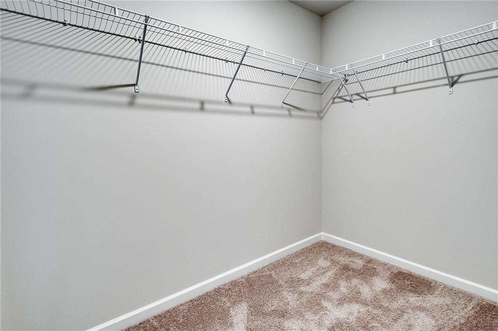 7437 Knoll Hollow Road Lithonia, GA 30058 - Photo 33 of 46 a view of a room with racks on the wall