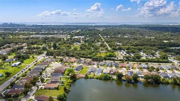 an aerial view of city and lake