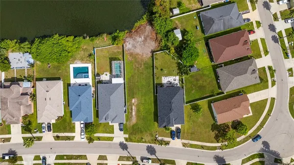 a view of a lake with houses in the back