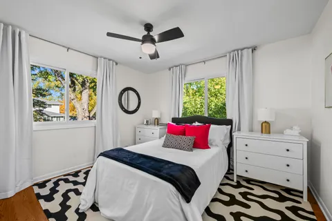 a bedroom with a bed and a dresser