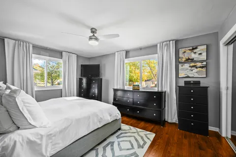 a bed room with a bed and a dresser