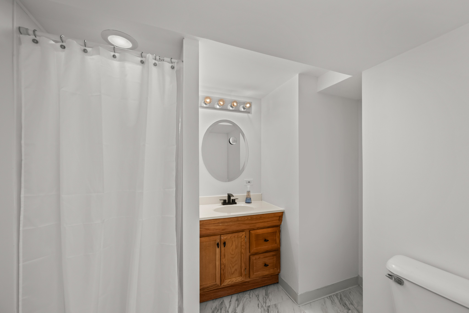2020 Walnut St Park Ridge Park Ridge, IL 60068 - Photo 19 of 28 a bathroom with a sink a toilet and a mirror