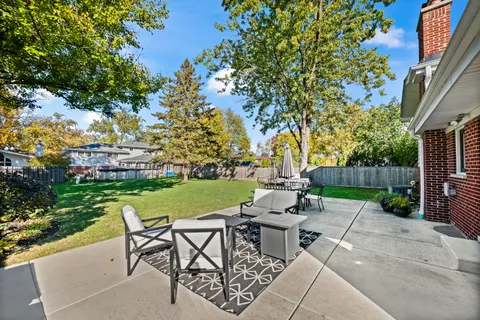 a view of a chairs and table in the garden