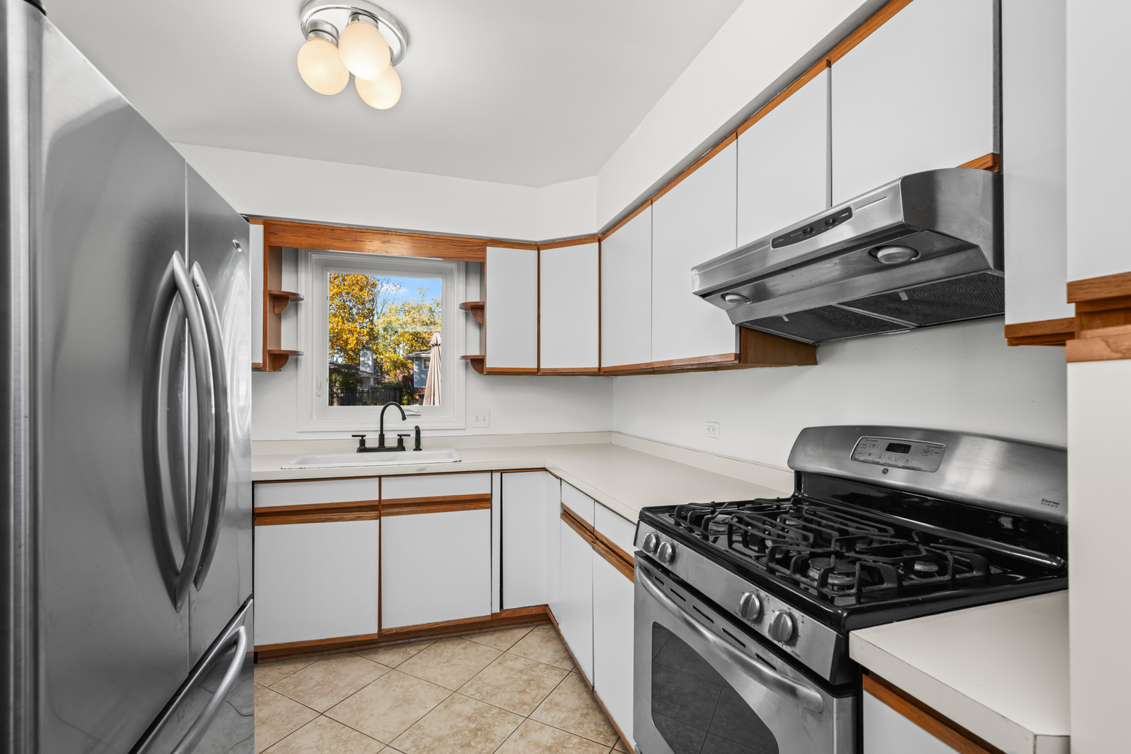 2020 Walnut St Park Ridge Park Ridge, IL 60068 - Photo 7 of 28 a kitchen with stainless steel appliances granite countertop a stove and a refrigerator
