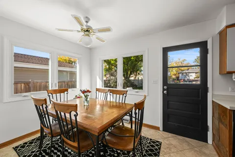 a view of a dining room with furniture window and outside view