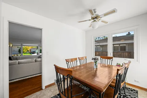 a view of a dining room with furniture and a window
