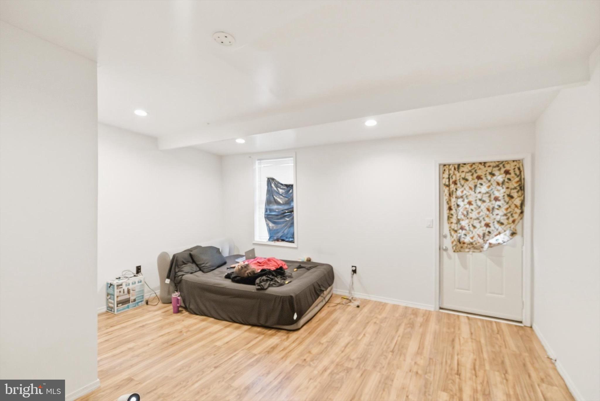 400 North 5th Street Reading, PA 19601 - Photo 13 of 25 a bedroom with a bed and a wooden floor