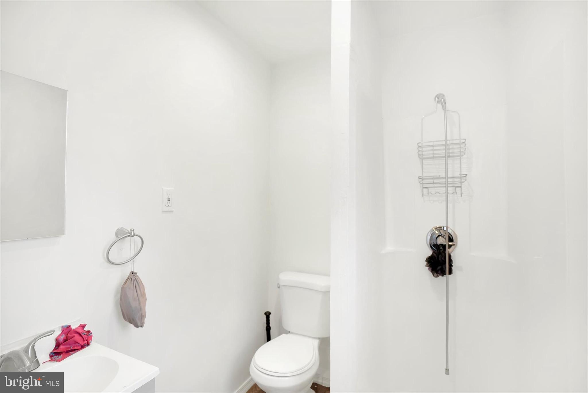 400 North 5th Street Reading, PA 19601 - Photo 14 of 25 a bathroom with a toilet sink vanity and window