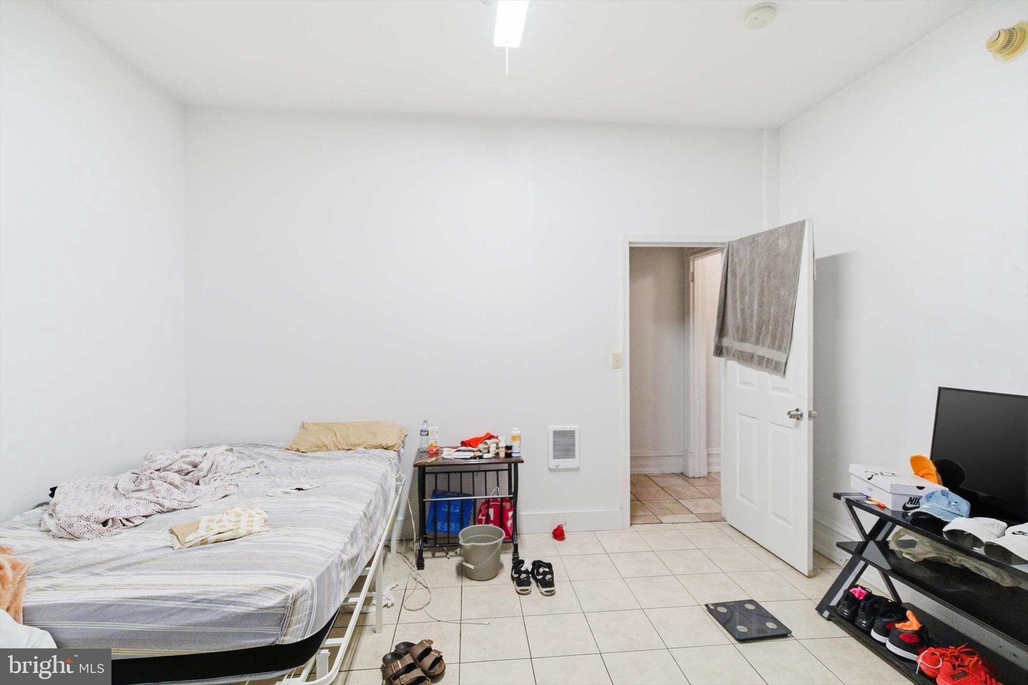 400 North 5th Street Reading, PA 19601 - Photo 22 of 25 a bedroom with a bed and a tv in it