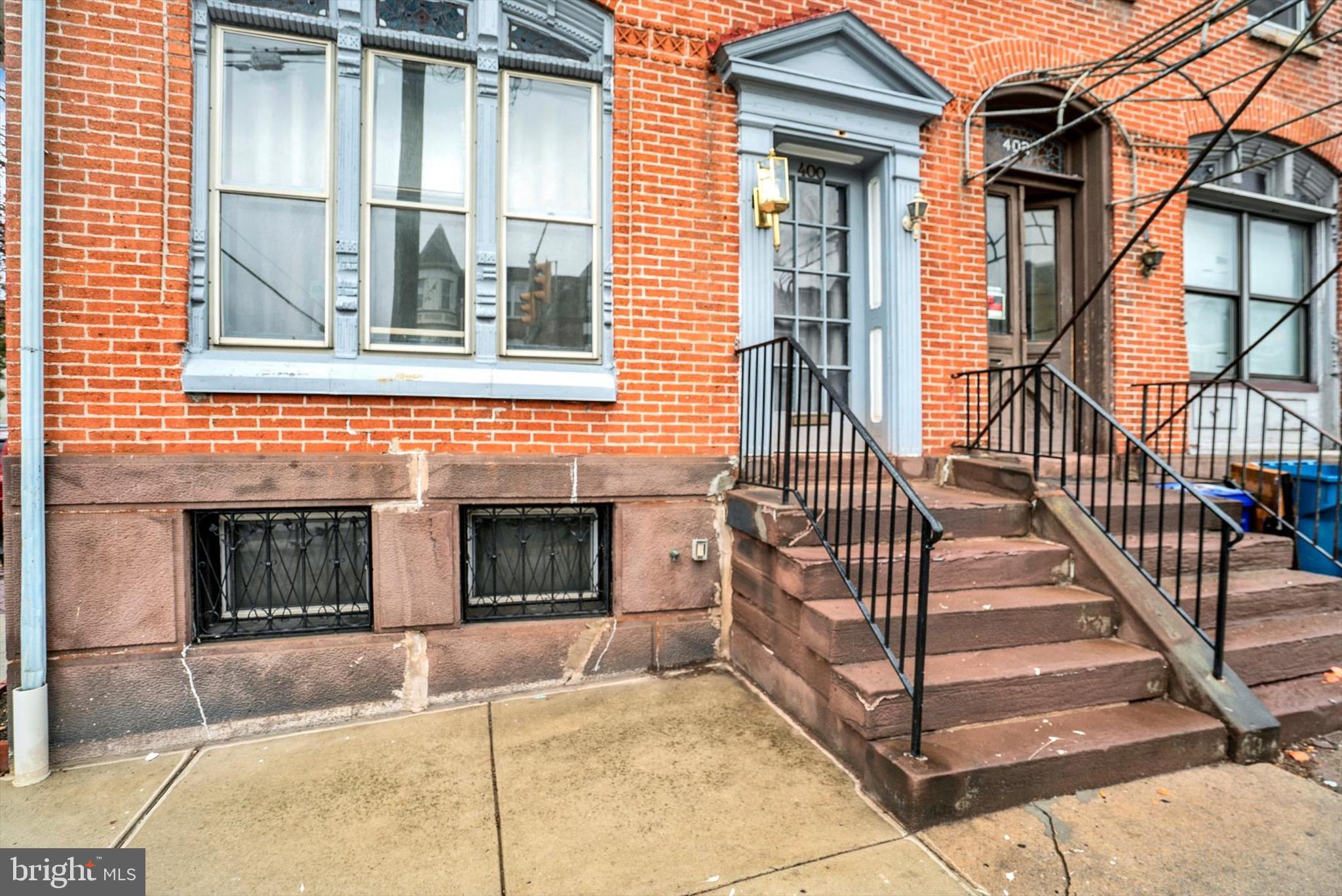 400 North 5th Street Reading, PA 19601 - Photo 3 of 25 a view of a house with wooden fence and a window