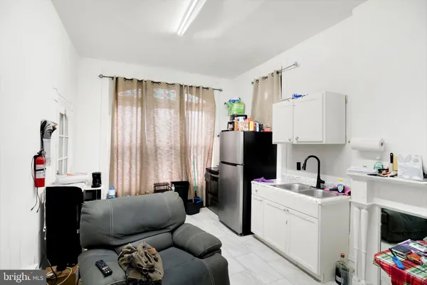a bedroom with a bed and cabinets