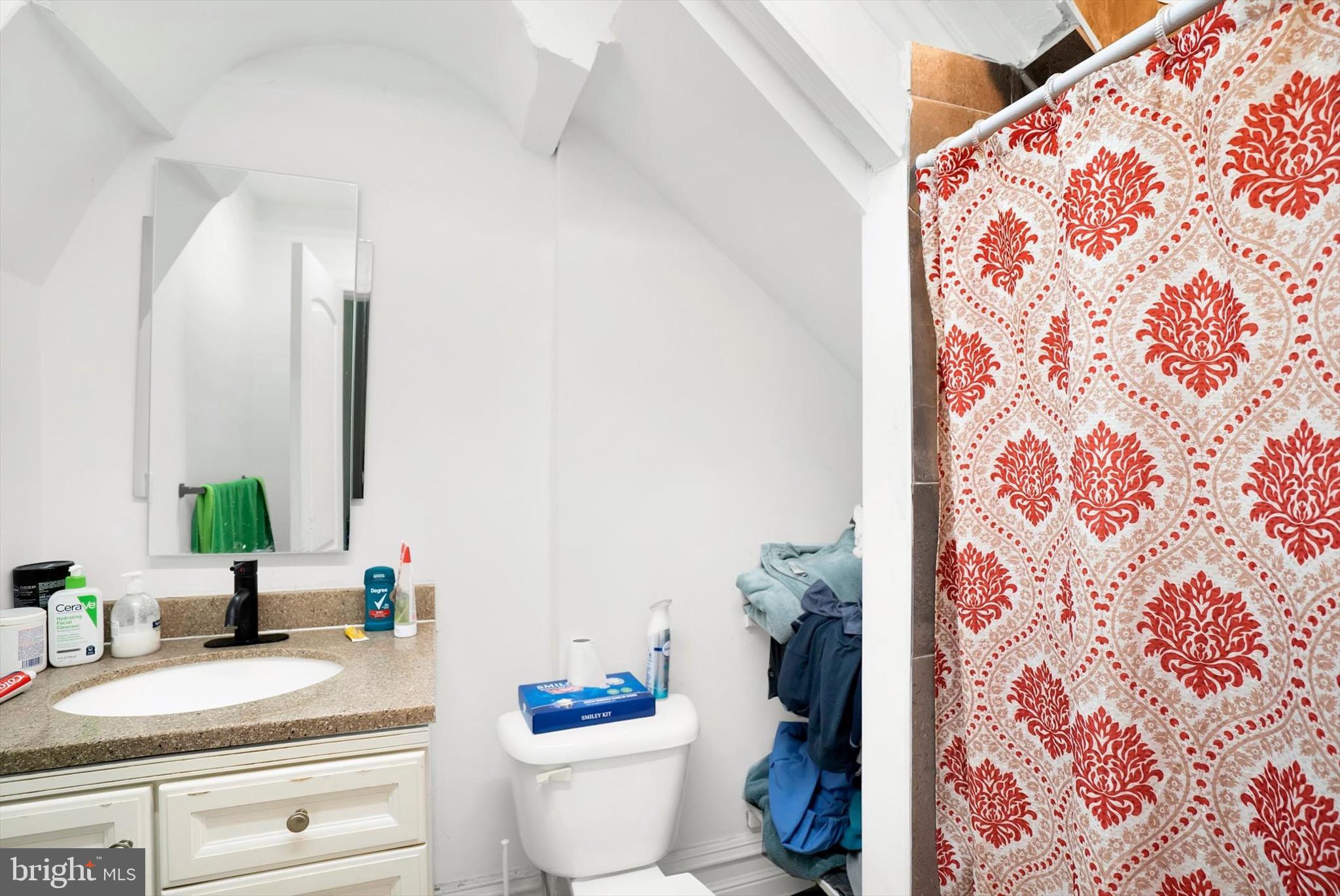 400 North 5th Street Reading, PA 19601 - Photo 9 of 25 a bathroom with a granite countertop sink and a mirror