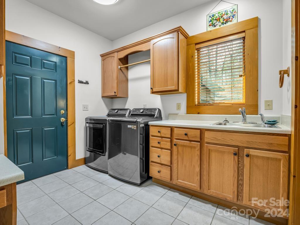 434 South Pointe Road Mill Spring, NC 28756 - Photo 12 of 48 a kitchen with stainless steel appliances granite countertop a stove a sink and a refrigerator