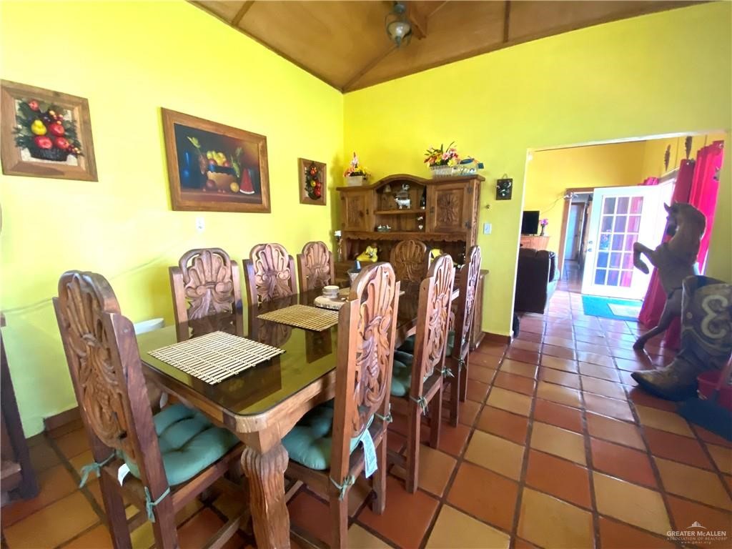 4113 Goodwin Road Mission, TX 78574 - Photo 11 of 14 a dining room with furniture and a rug