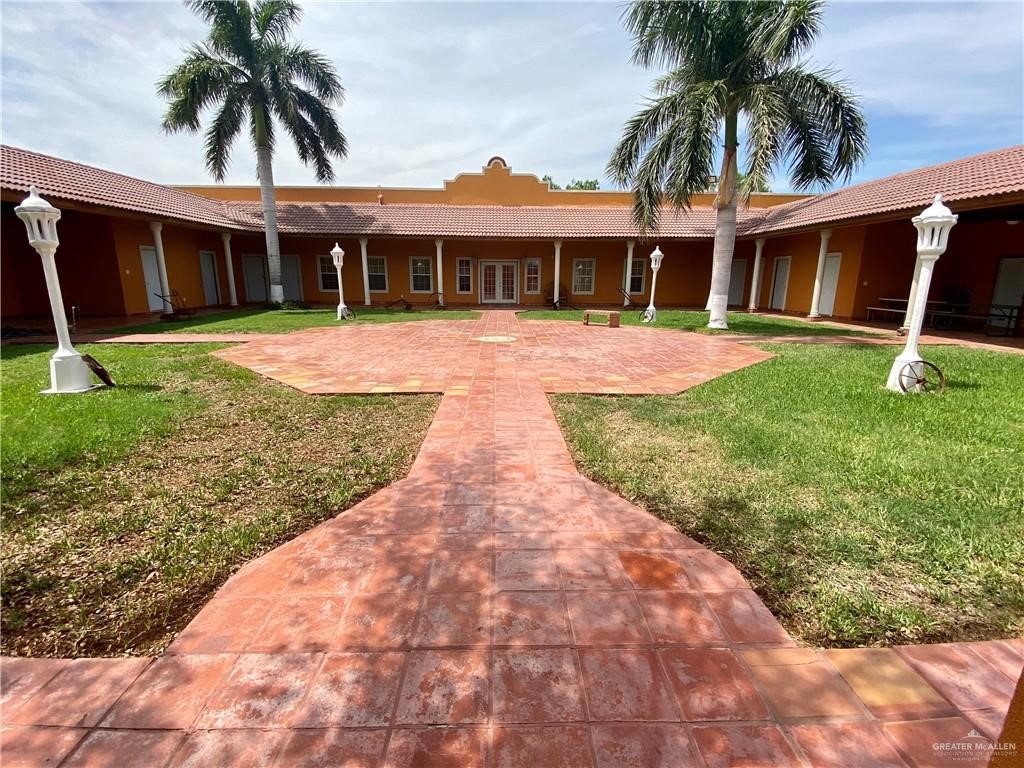 4113 Goodwin Road Mission, TX 78574 - Photo 7 of 14 a front view of a house with a garden