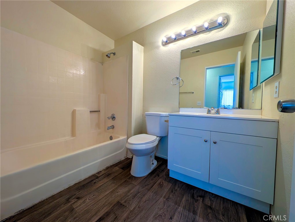 2795 Rosarita Street San Bernardino, CA 92407 - Photo 16 of 35 a bathroom with a toilet a sink and a bathtub