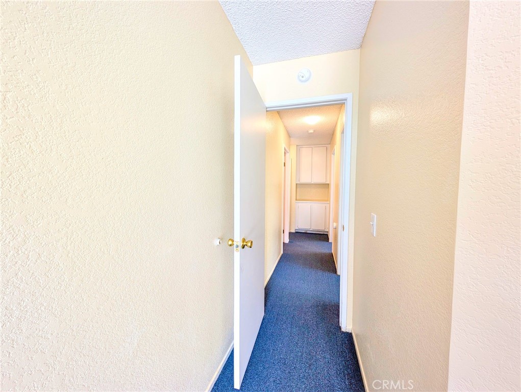 2795 Rosarita Street San Bernardino, CA 92407 - Photo 20 of 35 a view of a hallway with wooden floor