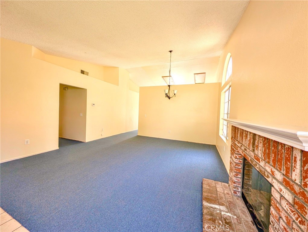 2795 Rosarita Street San Bernardino, CA 92407 - Photo 2 of 35 a view of empty room with wooden floor