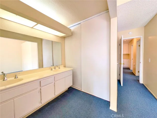 a white toilet sitting next to a bath tub