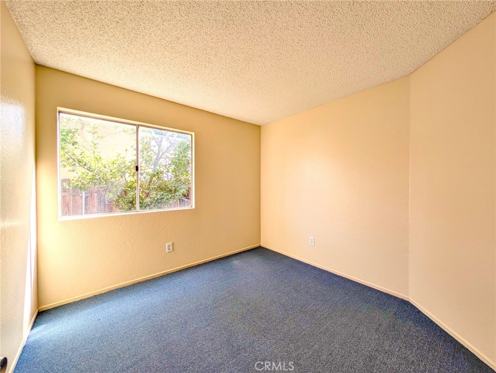 2795 Rosarita Street San Bernardino, CA 92407 - Photo 30 of 35 an empty room with a window