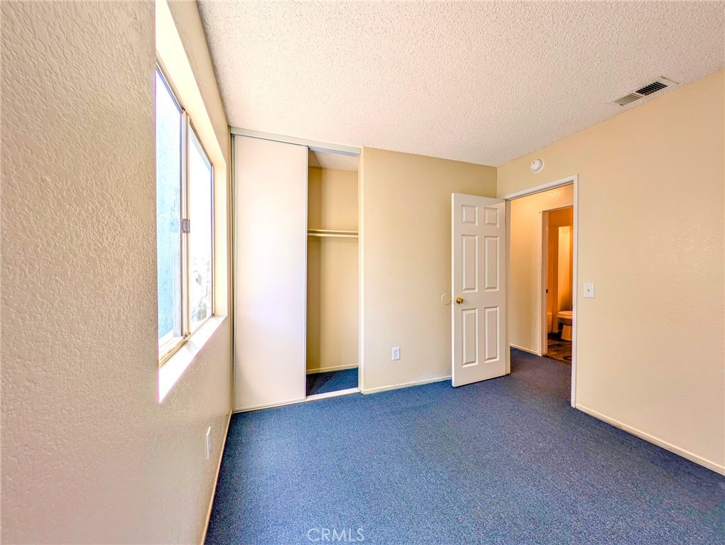 2795 Rosarita Street San Bernardino, CA 92407 - Photo 32 of 35 a view of an empty room with a window