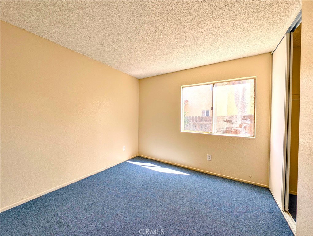 2795 Rosarita Street San Bernardino, CA 92407 - Photo 33 of 35 an empty room with a window