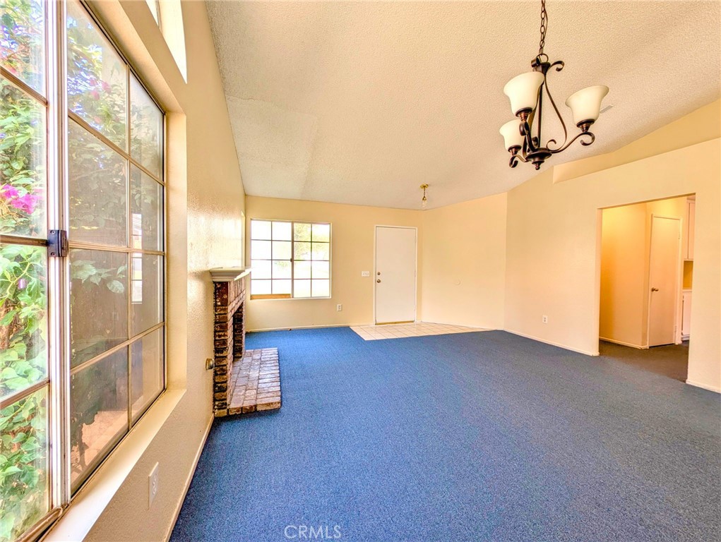 2795 Rosarita Street San Bernardino, CA 92407 - Photo 5 of 35 a view of empty room with wooden floor and windows