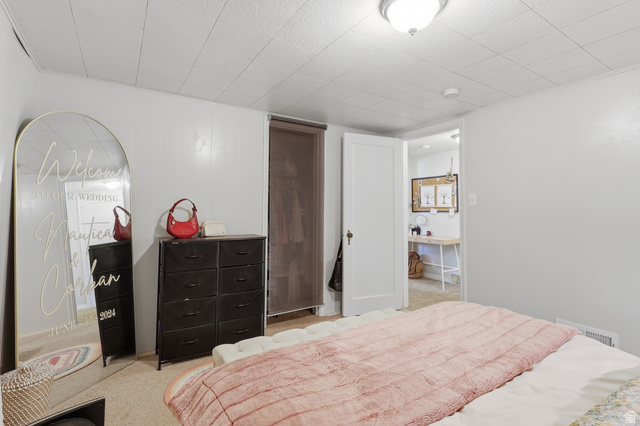 85 North 800 West Provo, UT 84601 - Photo 19 of 25 White paneled walls and a drop ceiling with a flush-mount light fixture