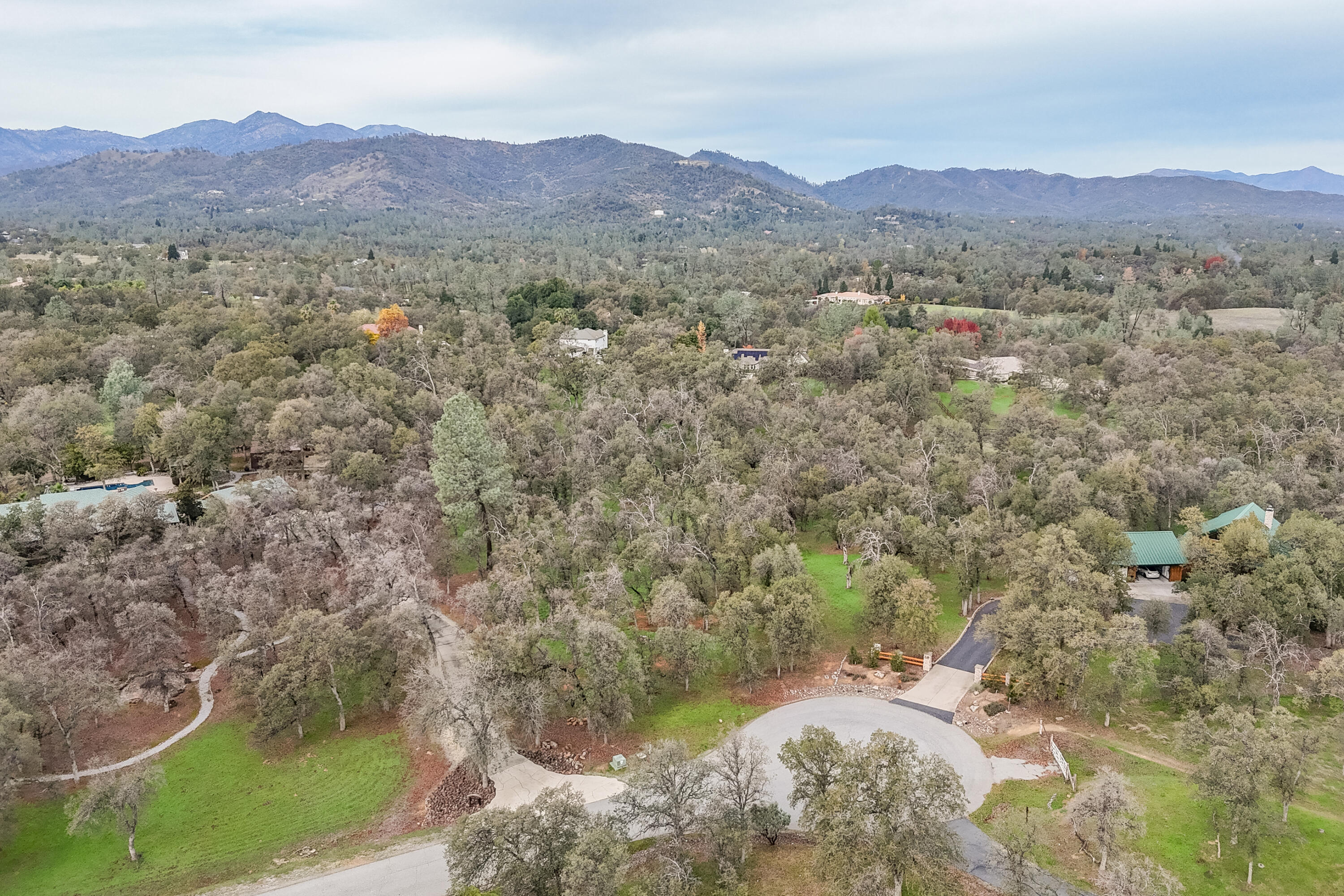 El Camino Robles Road Redding, CA 96001 - Photo 6 of 12 a view of a lush green hillside and houses