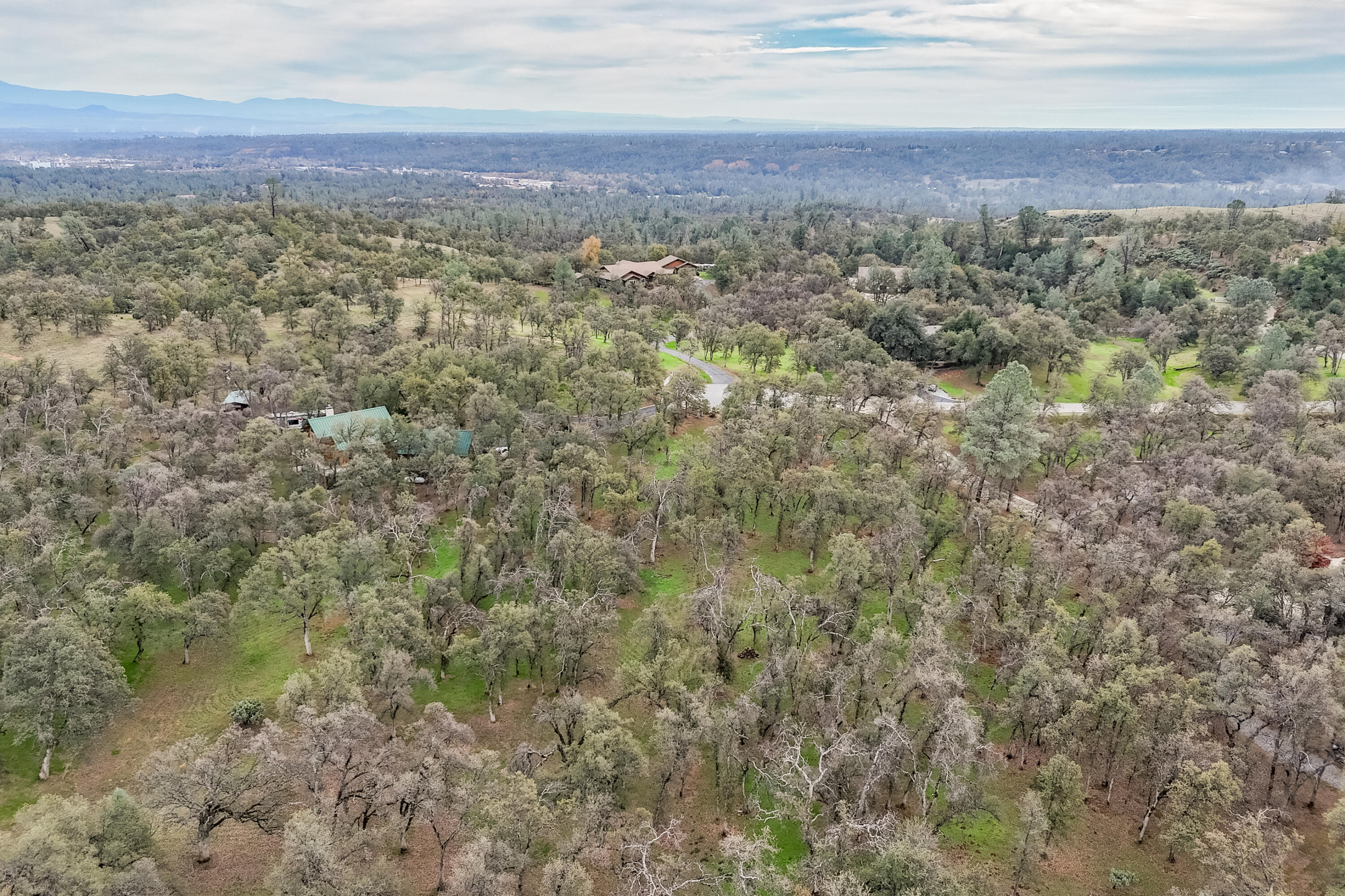 El Camino Robles Road Redding, CA 96001 - Photo 9 of 12 an aerial view of residential houses with outdoor space and trees
