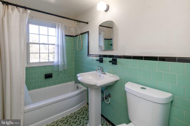 a bathroom with a sink a toilet and a bathtub