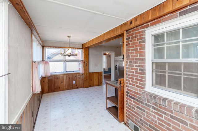 a living room with a couch and a window