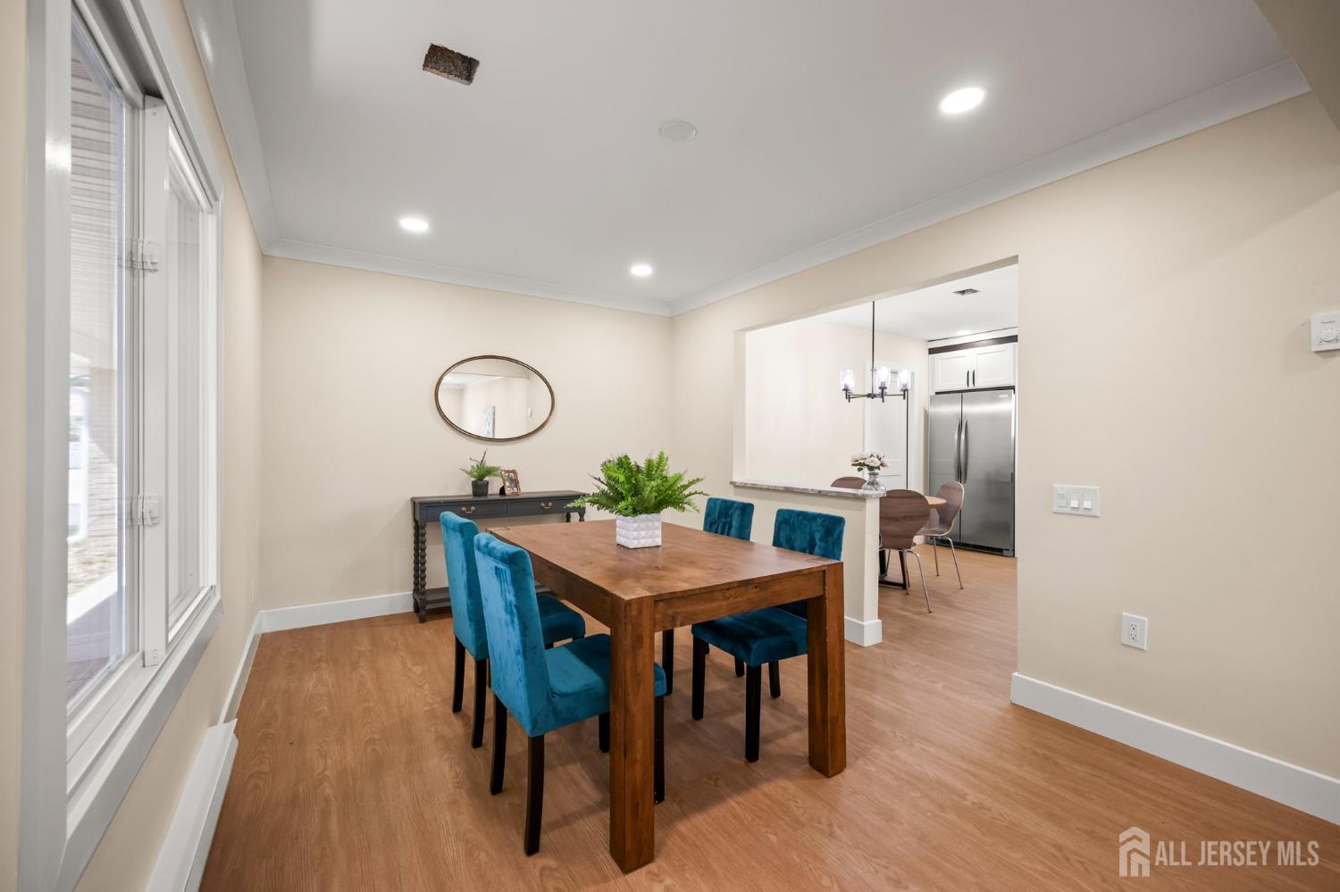 701 Croydon Road, Unit A Monroe Township, NJ 08831 - Photo 7 of 34 a view of a dining room with furniture and wooden floor