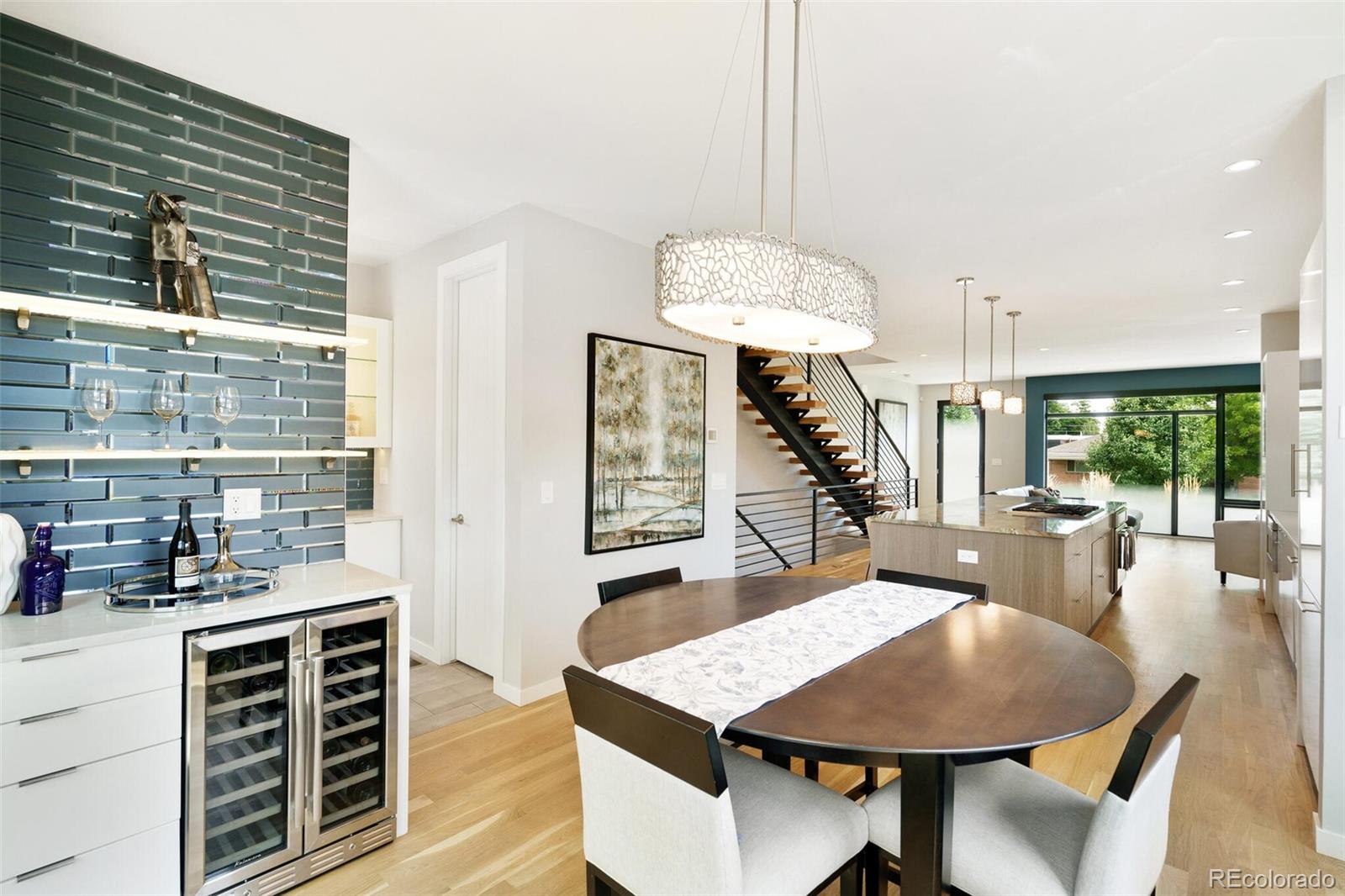 2145 King Street Denver, CO 80211 - Photo 11 of 40 a dining room with furniture a rug and wooden floor