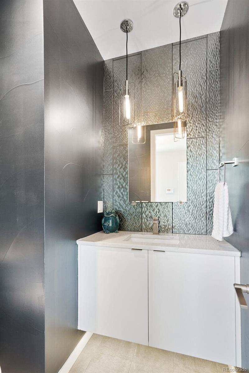 2145 King Street Denver, CO 80211 - Photo 14 of 40 a bathroom with a sink and a mirror