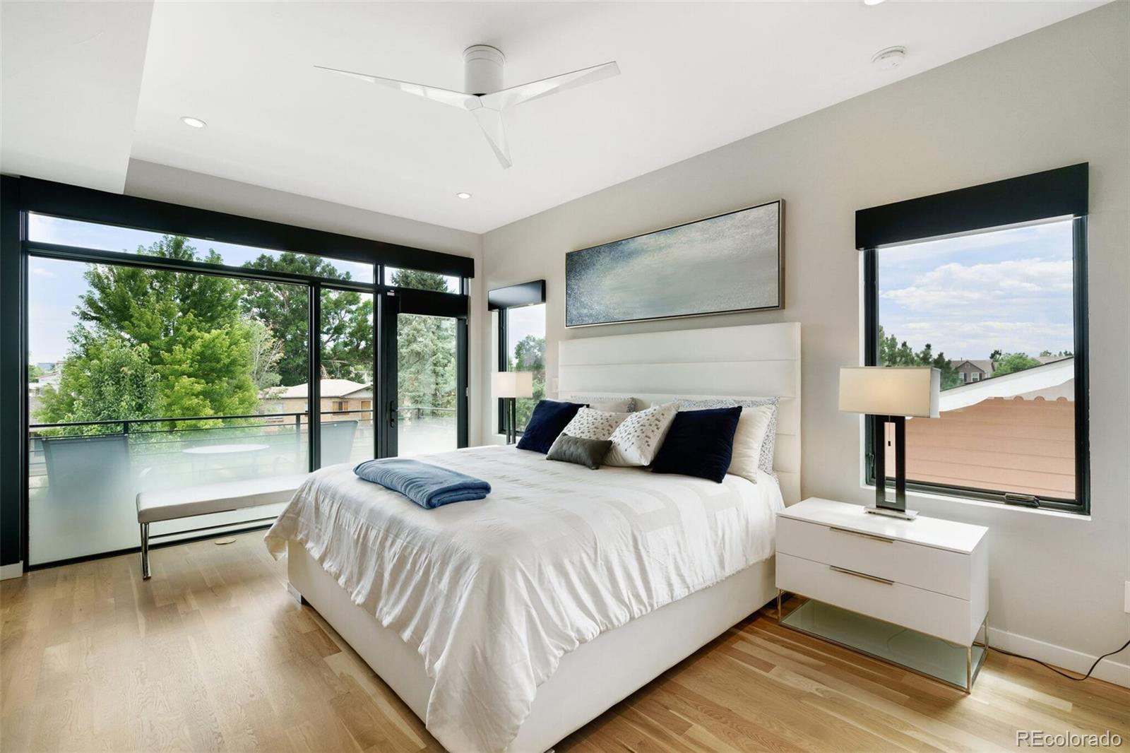 2145 King Street Denver, CO 80211 - Photo 15 of 40 a bedroom with a large bed and a large window