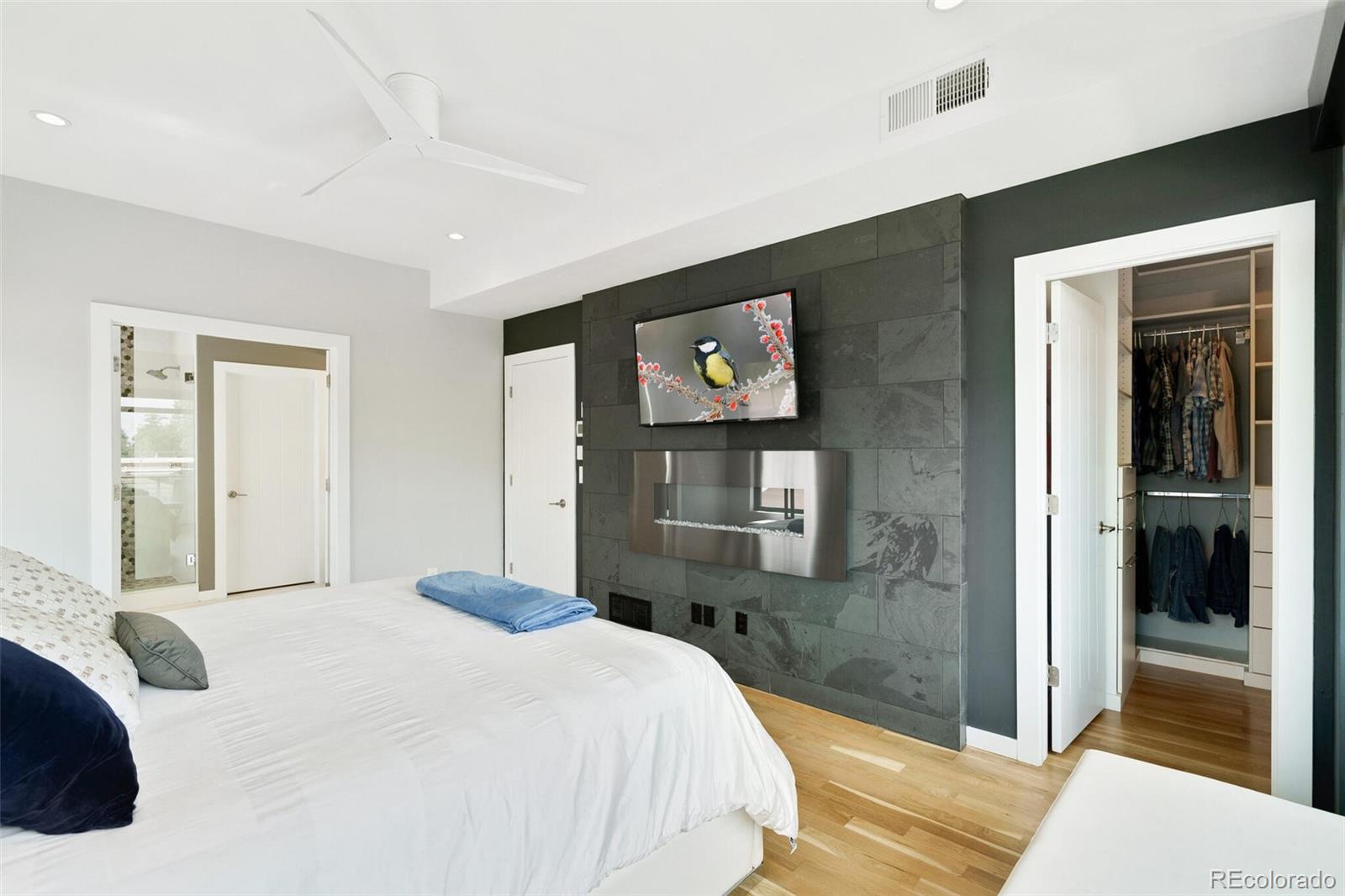 2145 King Street Denver, CO 80211 - Photo 16 of 40 a bedroom with a bed and a flat screen tv