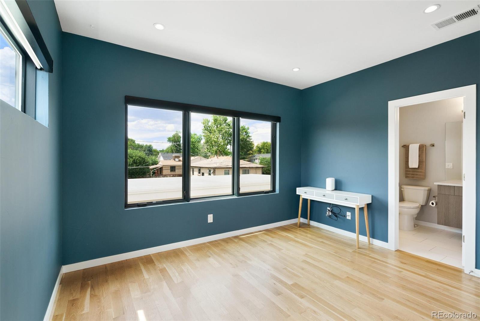 2145 King Street Denver, CO 80211 - Photo 20 of 40 a bedroom with a bed and a window