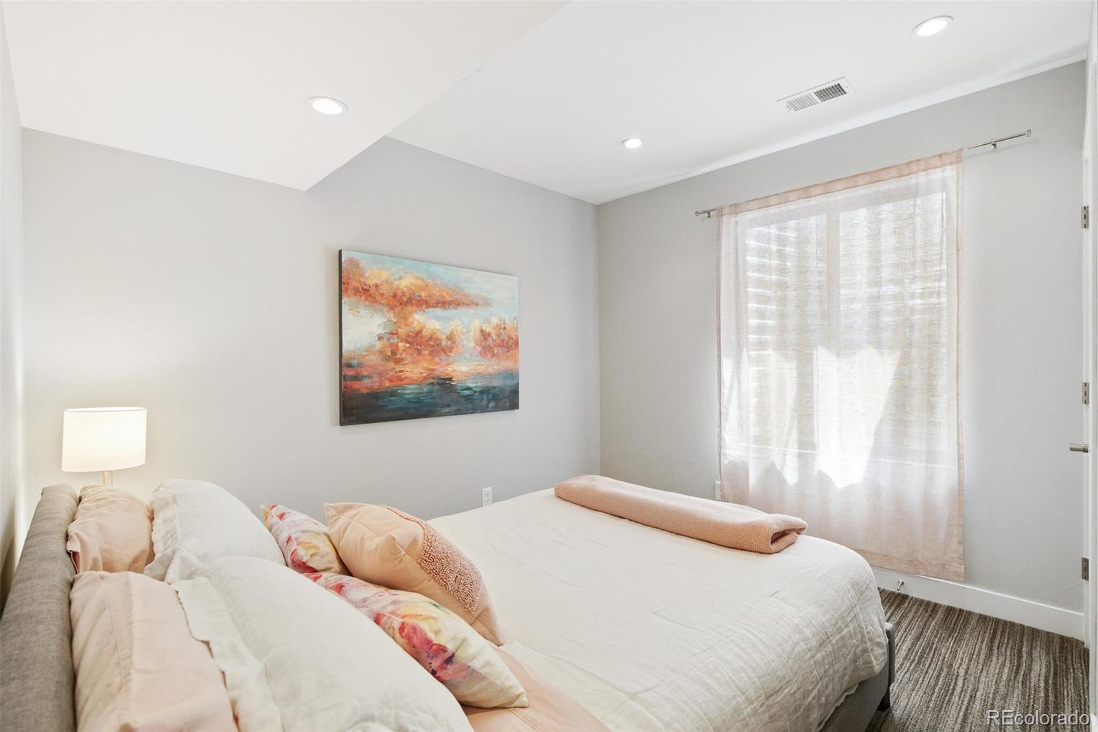 2145 King Street Denver, CO 80211 - Photo 30 of 40 a bedroom with a bed and a painting