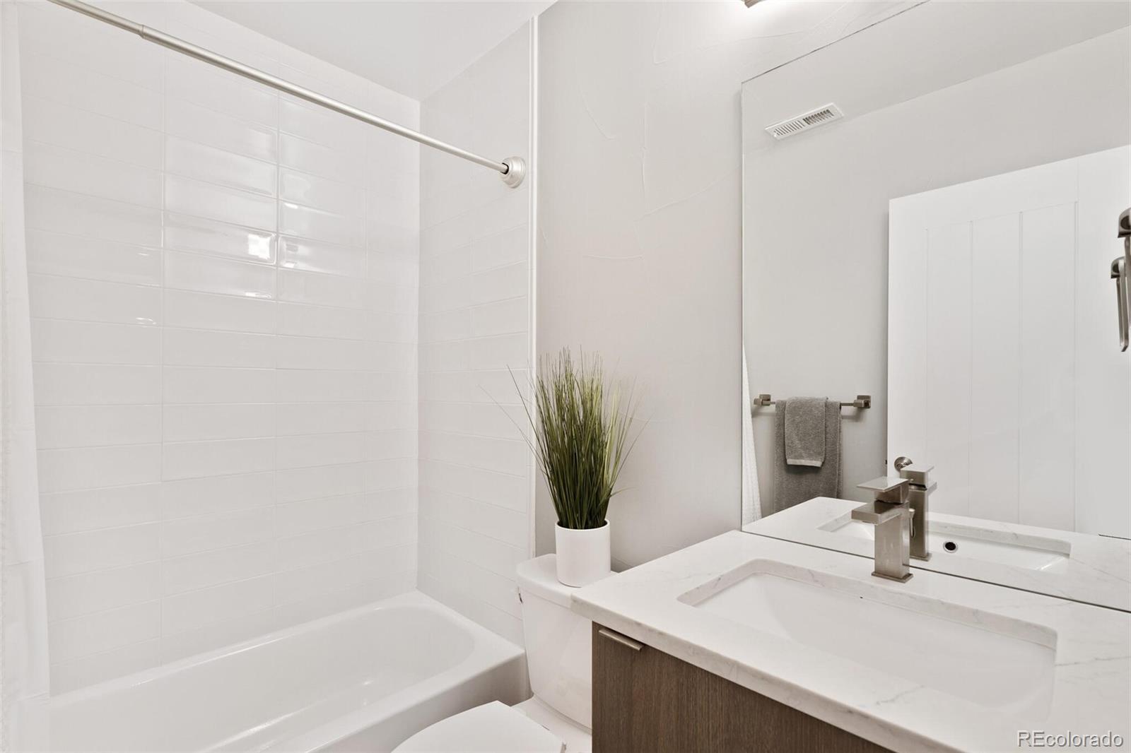 2145 King Street Denver, CO 80211 - Photo 31 of 40 a bathroom with a bathtub and a sink