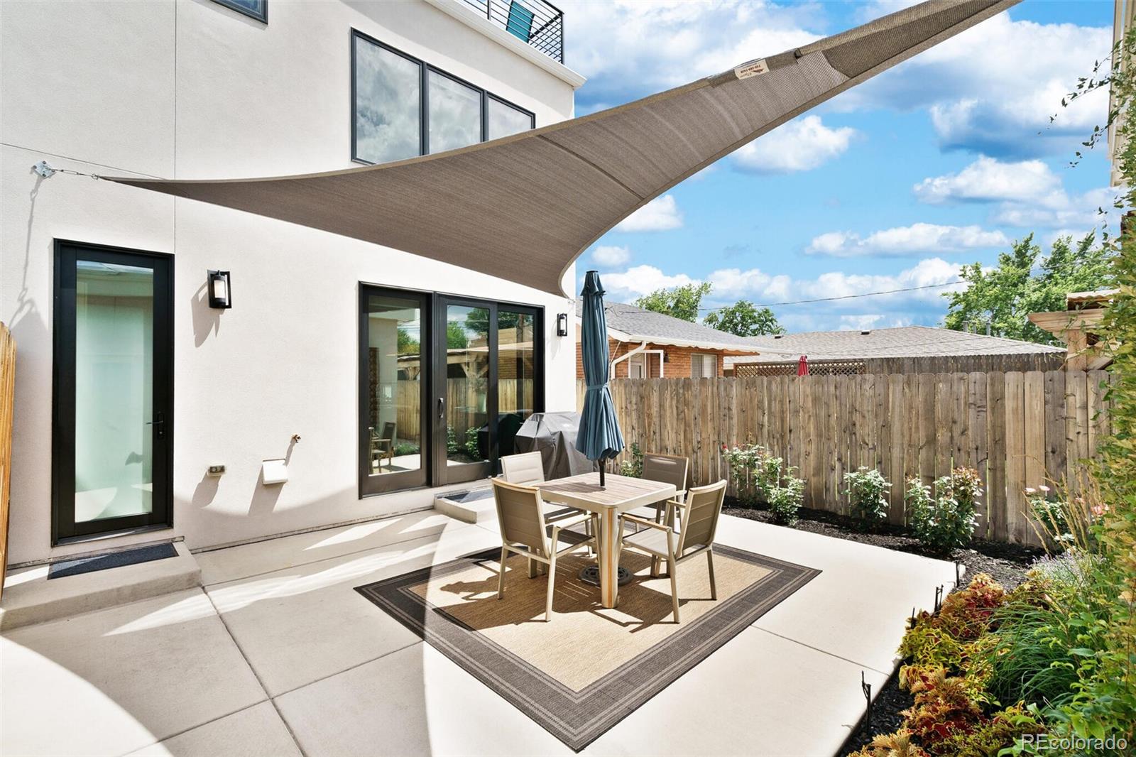 2145 King Street Denver, CO 80211 - Photo 33 of 40 a building outdoor space with patio furniture and potted plants