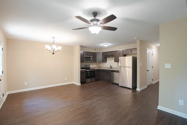 a view of kitchen with cabinet and wooden floor