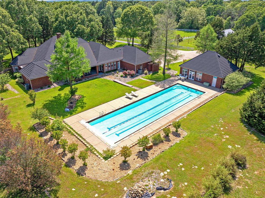 a view of a tennis ground with a large pool