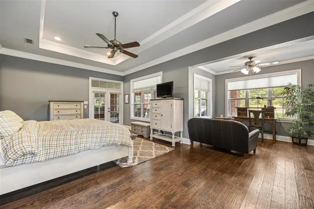 a bedroom with a bed window and a couch