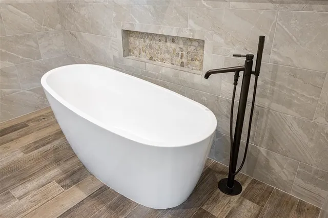 a view of a bathroom with a sink and mirror